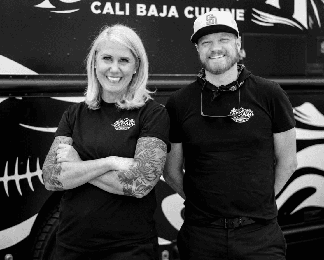 Johnathan and Cindy in front of the Fire & Ash truck.